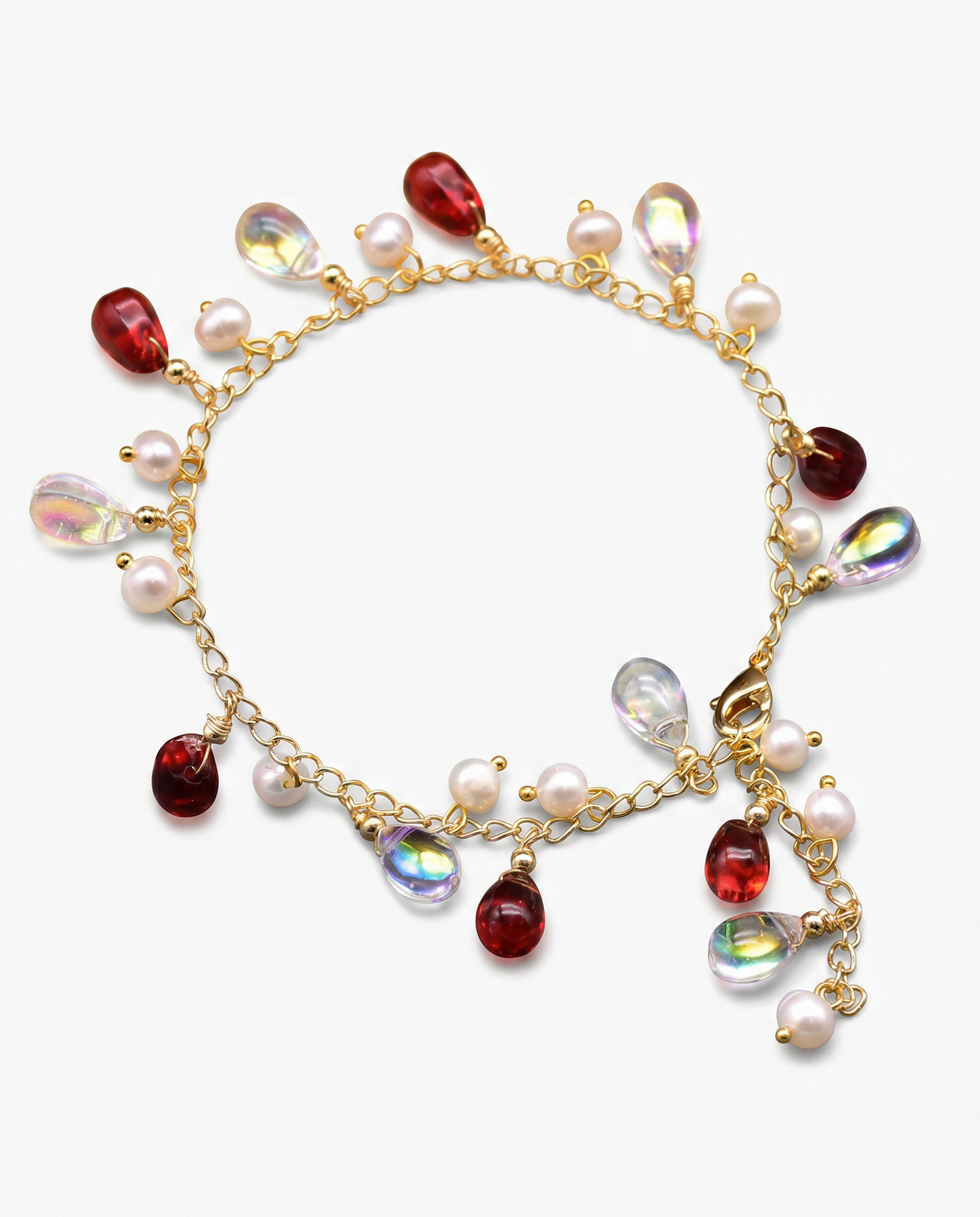 Gold chain bracelet with red teardrop crystal rainbow teardrop and pearl charms Ð FOUND Jewelry Canada