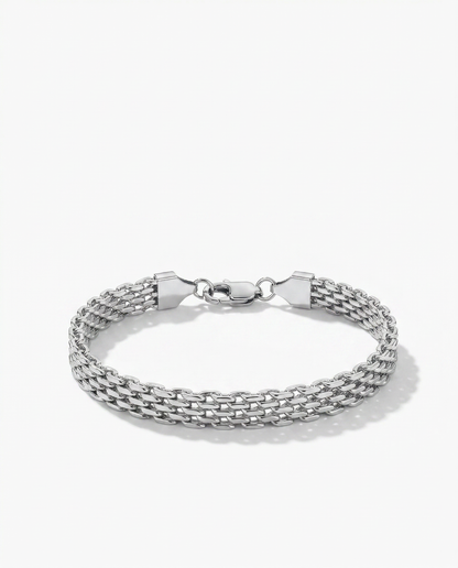 Silver flat woven wide link chain bracelet lying flush against wrist Ð FOUND Jewelry Canada