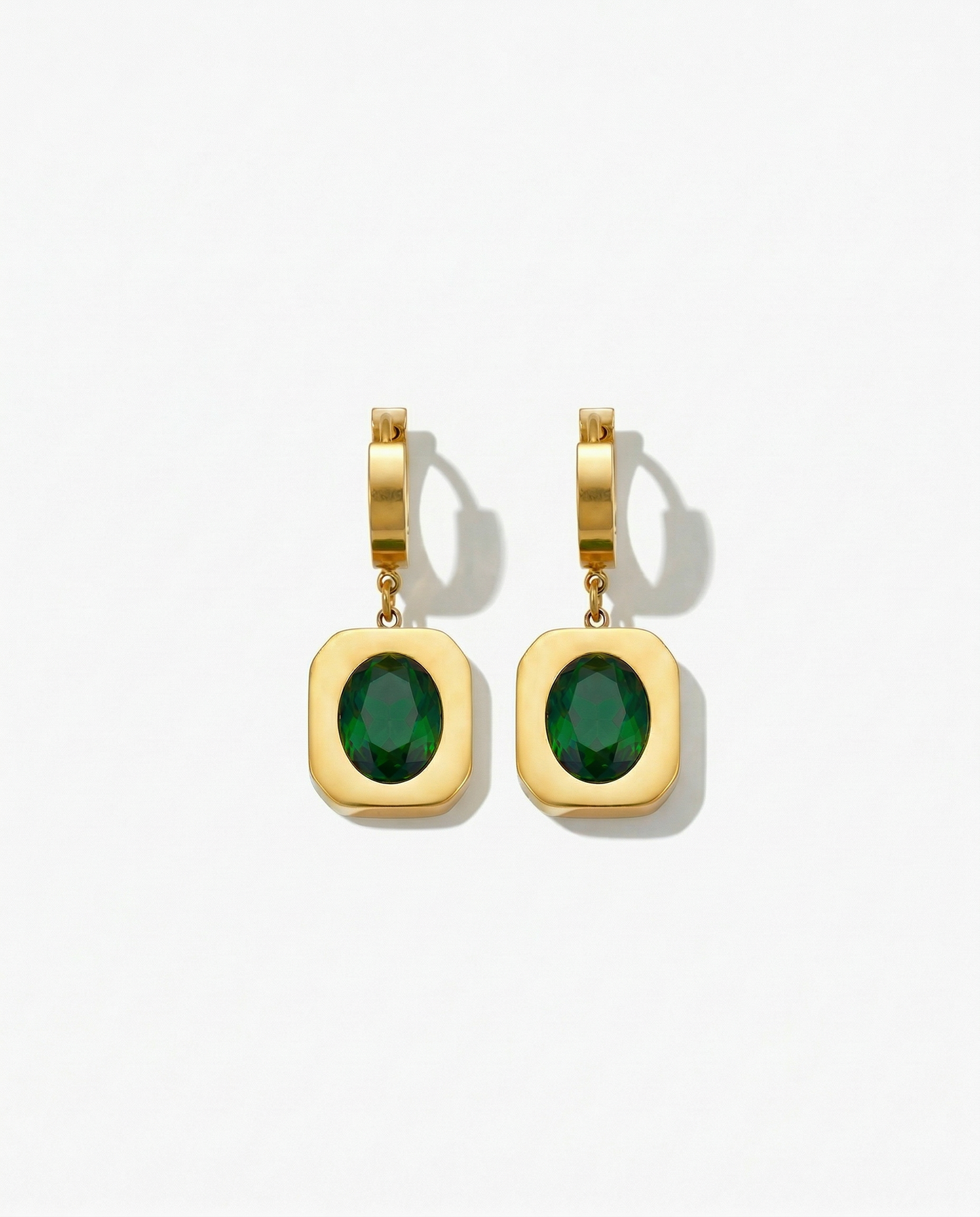 Gold huggie earring with wide gold frame pendant holding deep green oval stone Ð-FOUND Jewelry Canada