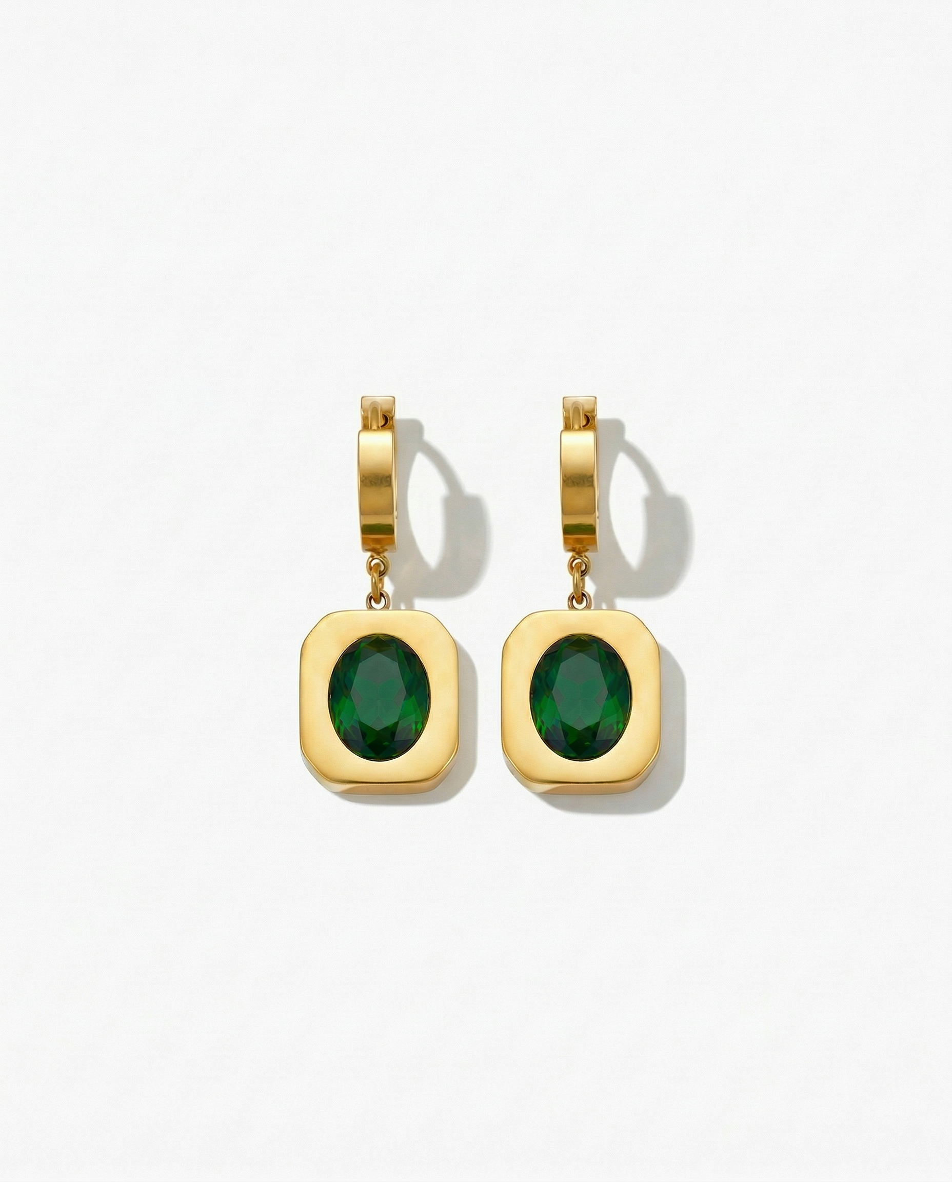 Gold huggie earring with wide gold frame pendant holding deep green oval stone Ð-FOUND Jewelry Canada