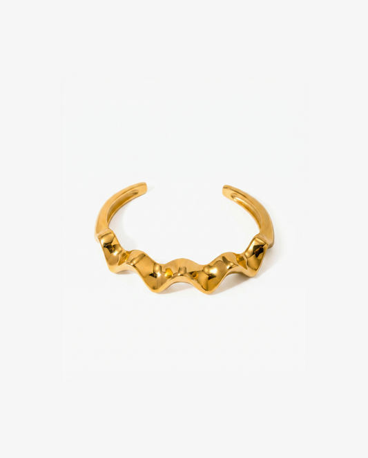Bold gold open cuff bracelet with wide sculptural wave across the front - FOUND Jewelry Canada