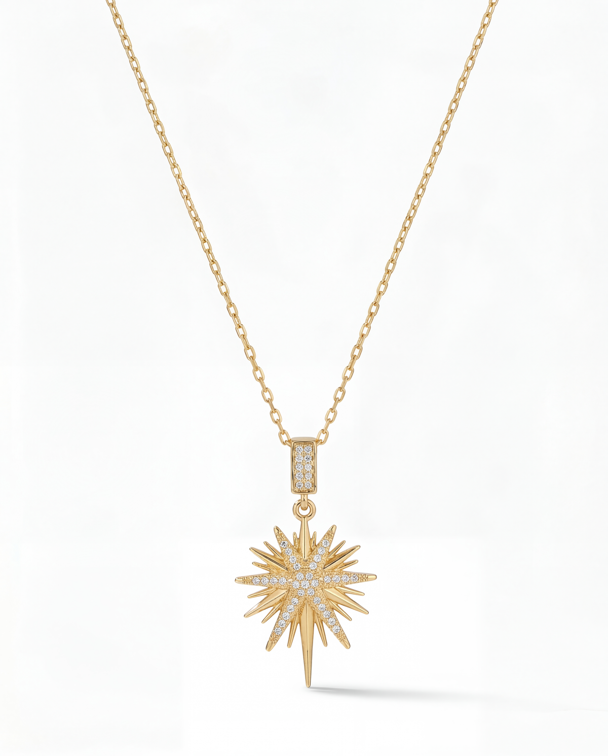 Gold starburst pendant necklace with pavŽ CZ centre and one long downward spike drop - FOUND Jewelry