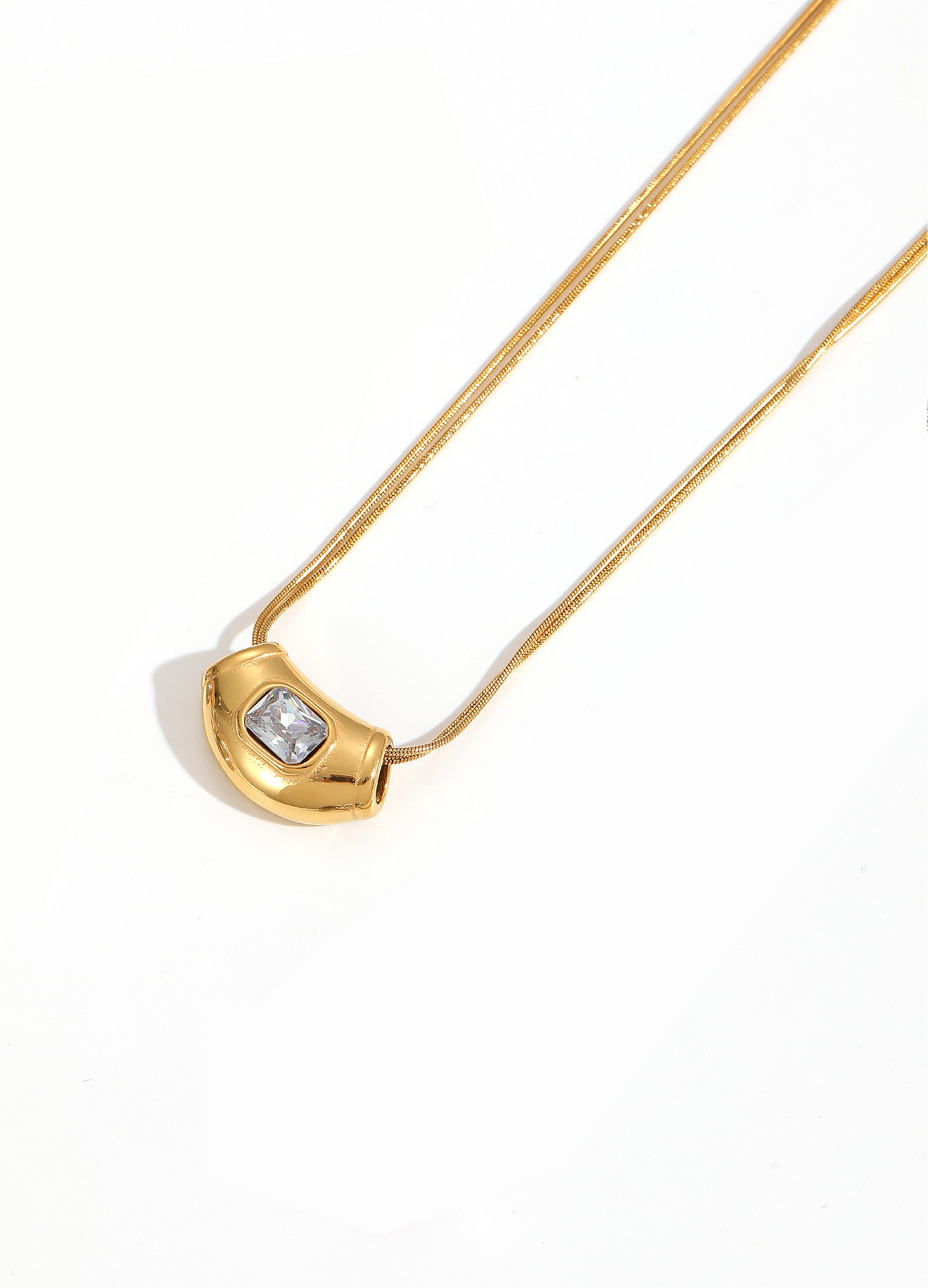 Gold flat snake chain necklace with chunky gold bean pendant and single square CZ stone - FOUND Jewelry Canada