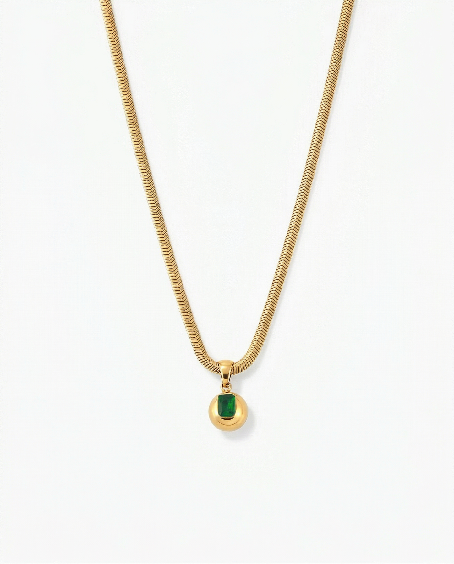 Gold orb pendant on herringbone snake chain with rectangle green CZ stone set into face - FOUND Jewelry Canada