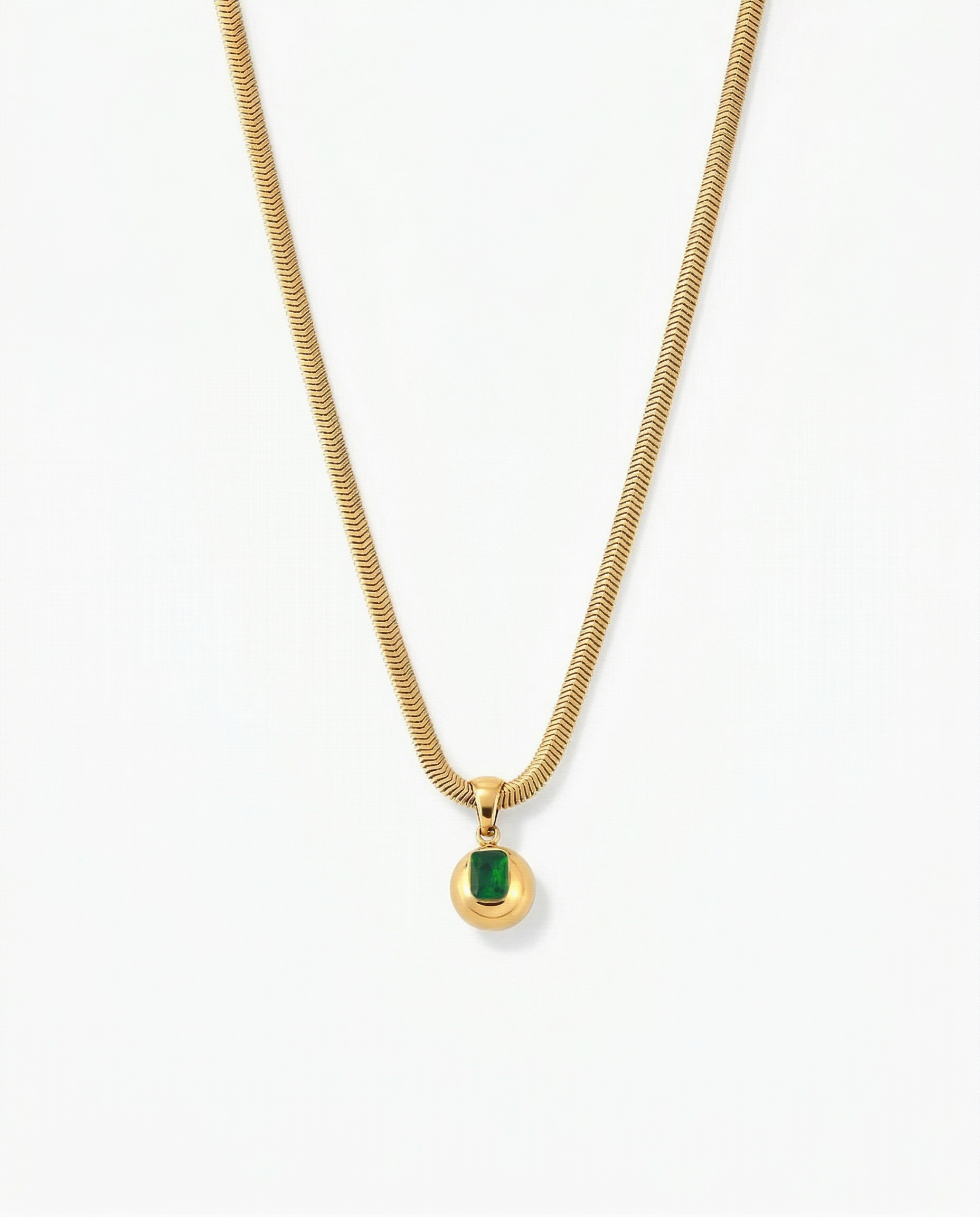 Gold orb pendant on herringbone snake chain with rectangle green CZ stone set into face - FOUND Jewelry Canada